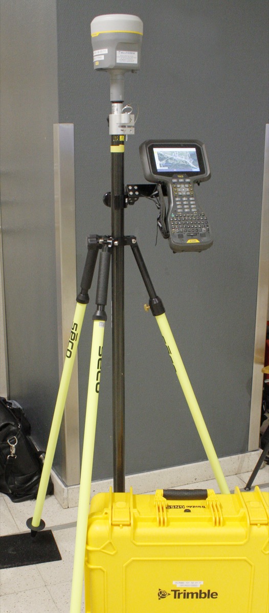 Trimble R980 GNSS receiver with field controller on a survey pole